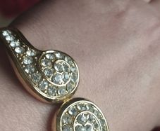 Beautiful gold-tone suit bracelet with crystals.