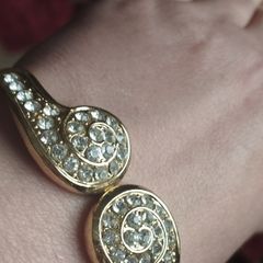 Beautiful gold-tone suit bracelet with crystals.