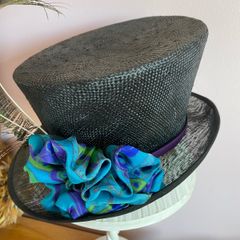 Stunning back hat with silk trim and peacock feathers