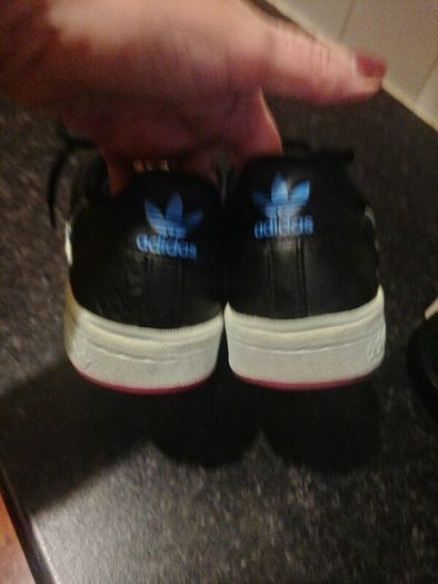 beautiful black leather Adidas runners