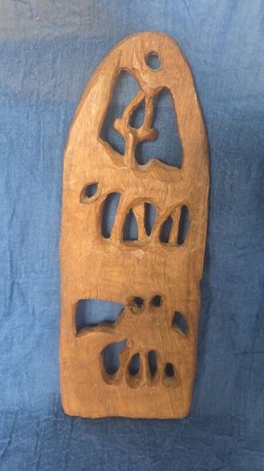 Hand-carved wooden wall hanging