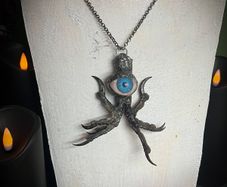 Protective Raven Claws Soldered with a Prosthetic Blue Eye Talisman