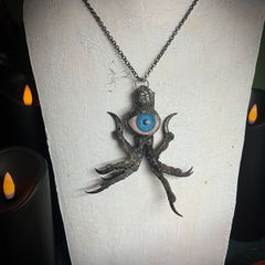 Protective Raven Claws Soldered with a Prosthetic Blue Eye Talisman