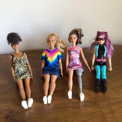 4 Barbie Dolls