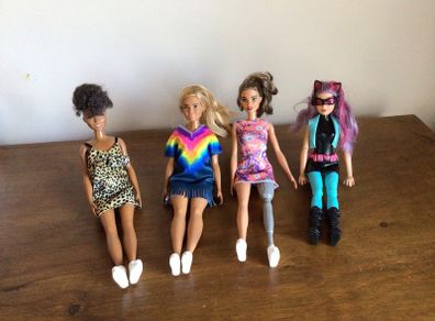 4 Barbie Dolls