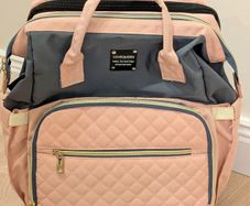 Baby diaper bag with built in changing station