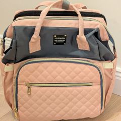 Baby diaper bag with built in changing station