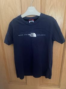 Navy North Face short sleeved T-shirt size Small (7-8 years)