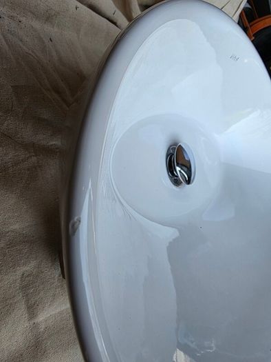 Countertop basin with countertop mounted tap