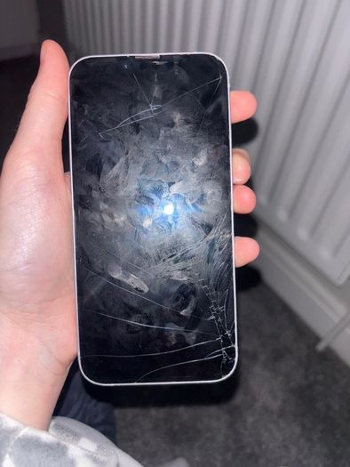 i phone 14 slight cracked screen can't even see it 74% battery