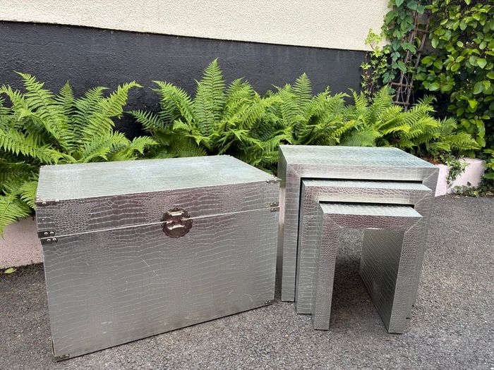 3 silver coloured tables and chest