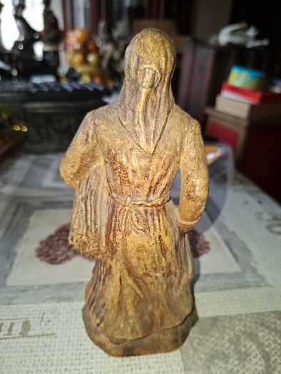 Peasant woman c1950s Wearing a Headscarf and Apron while carrying a bundle of provisions, features detailed facial expressions, textured clothing folds, and a base characteristic of regional decorative collectibles, Postage Available or Collection,