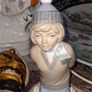 Old Ornament of a Boy in a Winter Hat and Light Colored Clothing on Skis, Made in Spain. Image 2