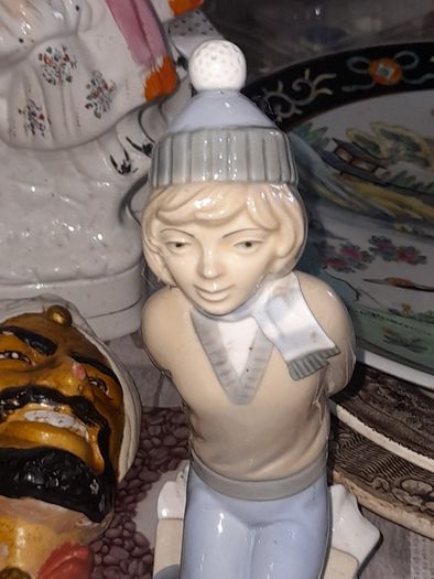 Old Ornament of a Boy in a Winter Hat and Light Colored Clothing on Skis, Made in Spain.