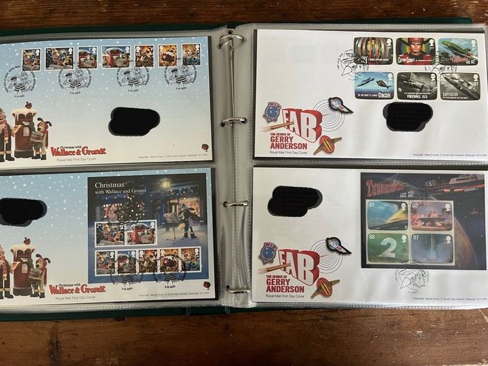 Collection of  77 UK First Day Cover stamps 2010 to 2013 in album
