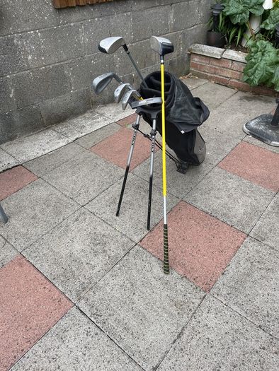 Left hand golf clubs and stand