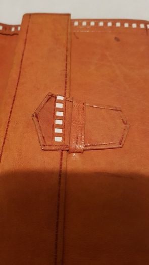 handcrafted made soft leather wallet,with designs ,, thank you,,was used,some wear and tear,,take as is ..