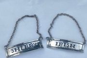 A pair of early 20th century decanter labels