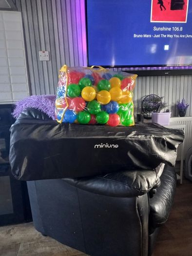 travel cot and balls