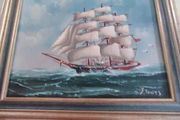 Framed oil of a sailing ship on board signed Y. Jones