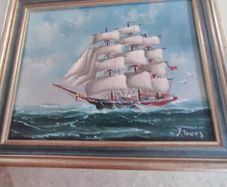 Framed oil of a sailing ship on board signed Y. Jones