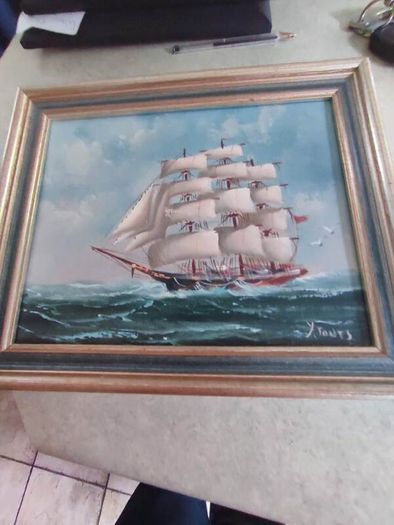 Framed oil of a sailing ship on board signed Y. Jones