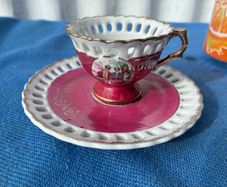 Vintage pierced cup and saucer