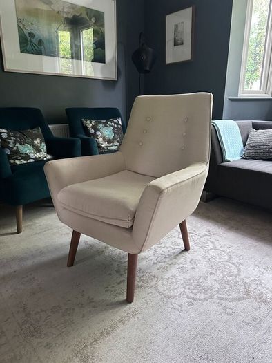 Two creme stylish armchairs