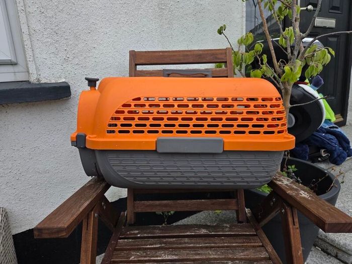 Dogit Voyageur Pet Carrier (Small size) in bright orange and charcoal.