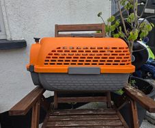 Dogit Voyageur Pet Carrier (Small size) in bright orange and charcoal.
