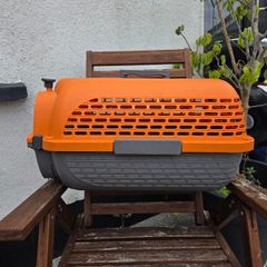Dogit Voyageur Pet Carrier (Small size) in bright orange and charcoal.