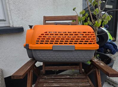 Dogit Voyageur Pet Carrier (Small size) in bright orange and charcoal.