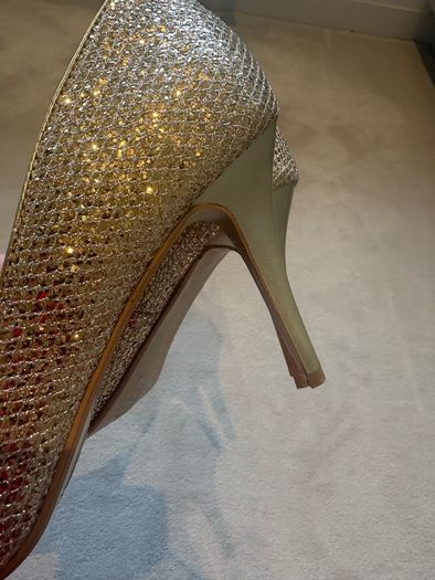 Gold glitter peep-toe heels.
