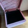 pink velour covered stool with interior storage space moves easily on castors Image 2