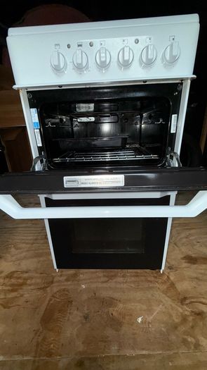 Electric stove and oven , 2 stands broken as seen in picture