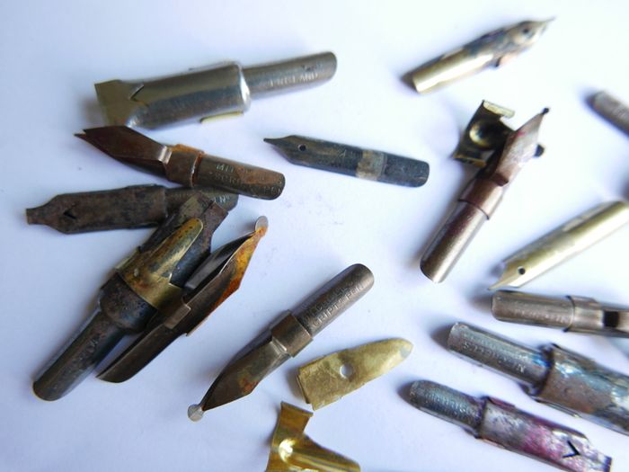 Vintage dip pen with collection of assorted nibs
