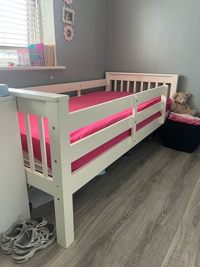white wooden single bed