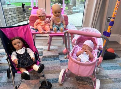 Two toy doll prams and 4 baby dolls