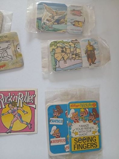 Scrace lot of 1980s retro cereal freebies . Kelloggs Rice crispies , sugar puffs stickers games and cards .