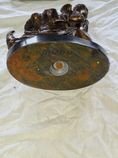 Bronzed Winged Cherub putto open seashell or leaf-shaped vessel with a scorpion like tail.