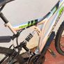 Rockway mountain bike silver and black frame with green accents and a full suspension system. Image 3