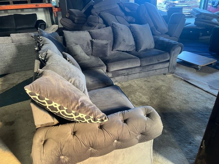 Grey corner sofa with scatter cushions