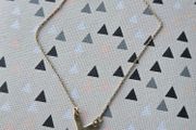 925 sterling silver bracelet with yellow gold plating and V shaped pendant.