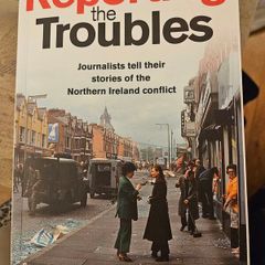 Reporting The Troubles. Journalists Tell Their Stories Of The Northern Ireland Troubles. First Edition Paperback In Good Condition.  See Photos For Same.