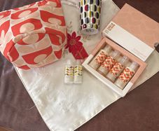 A Bundle of Orla Kiely Products - Bergamot Mini bath and hand set , a pull string wash bag, 2 empty body lotion and conditioner and a limited edition travel porcelain cup for Kenco