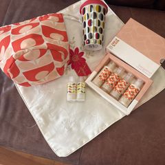 A Bundle of Orla Kiely Products - Bergamot Mini bath and hand set , a pull string wash bag, 2 empty body lotion and conditioner and a limited edition travel porcelain cup for Kenco
