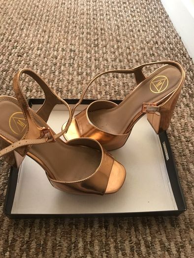 ladys shoes rose gold only wore once. Practically new.