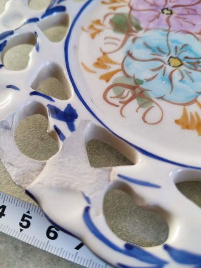 Vintage  19 cm. dimeter flowery  hinging wall plat made in Portugal.