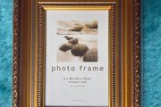 Gold-colored photo frame.