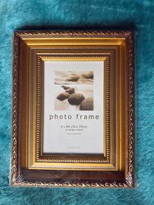 Gold-colored photo frame.